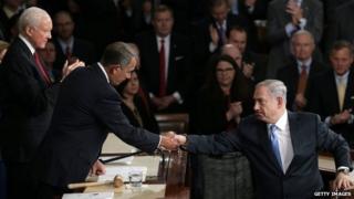 Israeli Prime Minister Benjamin Netanyahu (right) shakes hands with U.S. Speaker of the House John Boehner (left) after addressing a joint meeting of the United States Congress in the House chamber at the U.S. Capitol 3 March