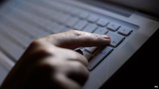 Person using a computer keyboard