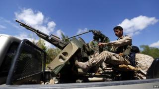 A Houthi fighter patrols streets in Sanaa. Photo: 24 March 2015