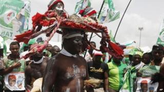 Supporters of Nigeria President Goodluck Jonathan dance during an election campaign rally at the National stadium in Lagos, Nigeria, 24 March 2015
