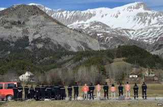 Rescue workers pay tribute to the air crash victims at Le Vernet, 27 March