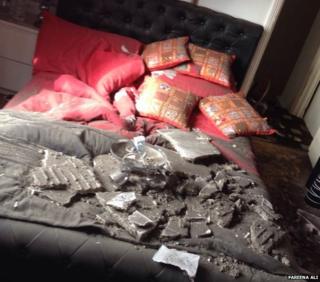 Ceiling debris lying on a bed