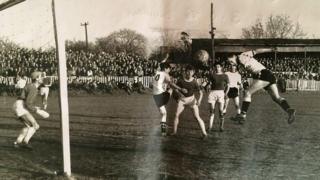 Jimmy Hasty rises to score a headed goal