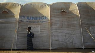 A young Somali refugee stands next to her family's shelter at the new Ifo-extension in Dadaab on 31 July 2011.