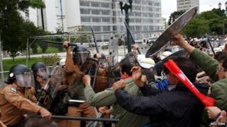 Policemen clash with teachers during a protest in Curitiba in Parana state April 29, 2015.