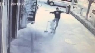 CCTV footage shows man brutally beating young boy in street, Yan'an city, Shaanxi province, China - 04 May 2015
