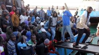Migrants disembark from a boat after the Libyan coastguard intercepted a boat with African migrants trying to reach Europe at the port in the city of Misrata east of Tripoli, Libya, 03 May 2015