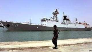 A Yemeni soldier keeps watch on the Chinese frigate, the Weifang, during an evacuation of Chinese people from Yemen in the western port city of Hodeidah, Yemen, on 30 March 2015