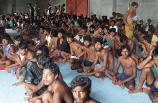 A group of rescued migrants mostly Rohingya from Myanmar and Bangladesh gathered on arrival at the new confinement area in the fishing town of Kuala Langsa in Aceh province on May 15, 2015.