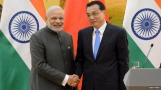 Mr Modi, left, and his Chinese counterpart Li Keqiang have pledged to improve bilateral ties between India and China