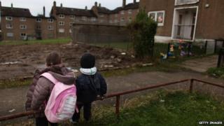 Children sat in council estate