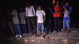 The body of Zedi Feruzi lies in the road near his home in Bujumbura's Ngagara district - May 23, 2015