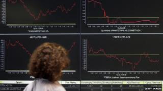 Screens displaying share prices in Greece