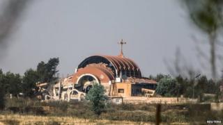 An Assyrian church is seen damaged in the village of Tel Nusri
