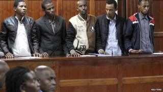 Tanzanian national Rashid Charles Mberesero (L) stands inside the dock with Osman Abdi Dakane (2nd L), Sahal Diriye Hussein (C), Hassan Aden Hassan (2nd R), Mohamed Abdi Abikar (R) at the Milimani Law Courts in Kenya"s capital Nairobi, June 4, 2015
