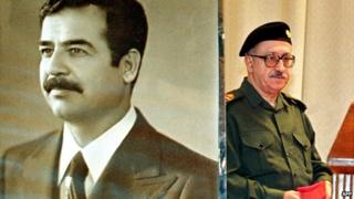 Tariq Aziz passes a poster of Saddam Hussein after a press conference in Baghdad - 24 November 1999