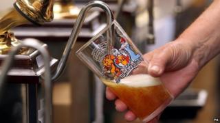A pint of beer being poured