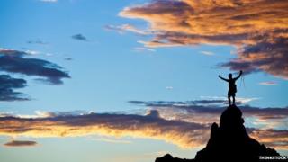climber on top of mountain