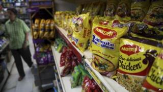 Packaged food with "Maggi" sign on it are displayed at a grocery store in Bangalore, India, Friday, June 5, 2015
