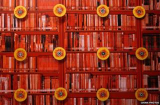 Discs are decorated on bookshelves at the 13th Beijing International Book Fair at China International Exhibition Center 30 August 2006 in Beijing, China.