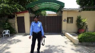 Policeman stands guard outside Save the Children office in Islamabad, Pakistan. 12 June 2015