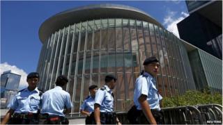Policemen patrol outside the Legislative Council building in Hong Kong