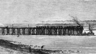 The Great Western Railway connects with a steam ferry on the Monmouthshire shore at low tide, during the construction of the Severn Tunnel in 1880