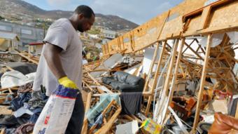 A resident of the Frenchtown district walks through the debris of his home 12 days after Hurricane Irma wrought havoc to the island, in Charlotte Amalie, St. Thomas, U.S. Virgin Islands