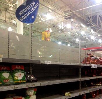 Supermarket shelves and sign reading "Made in socialism"