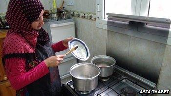Asia Thabet Rafaan cooking in Yemen