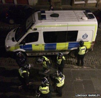 Police in riot gear prepare to search Edinburgh building