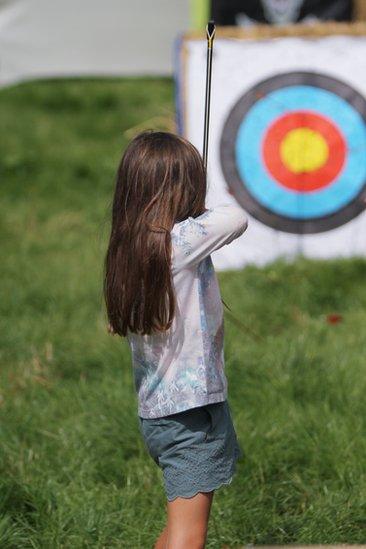 Archery instruction at the Little Folk children's area