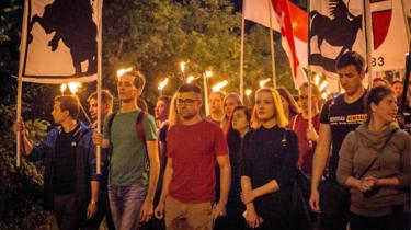 Sellner on a torch-lit march near Vienna in September 2017