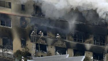 An aerial view shows firefighters battling the fires at Kyoto Animation Co