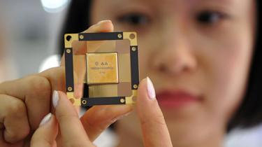 Woman holding 5G computer chip