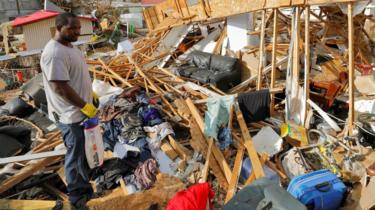 A resident of the Frenchtown district surveys his home 12 days after Hurricane Irma wrought havoc to the island, in Charlotte Amalie, St. Thomas, U.S. Virgin Islands