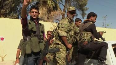 Turkish-backed Syrian opposition forces patrol in Dabiq