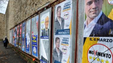 Election posters for Italian political parties on a wall in Florence, Italy on 4 March