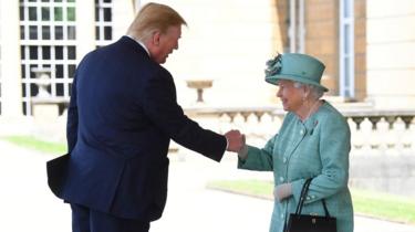 Queen Elizabeth II greets US President Donald Trump as he arrives for the Ceremonial Welcome at Buckingham Palace, London, o