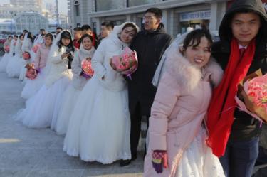 A mass wedding ceremony at the Harbin International Ice and Snow Festival