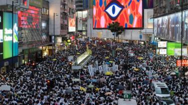 Thousands of protesters take part in a march against amendments to an extradition bill in Hong Kong