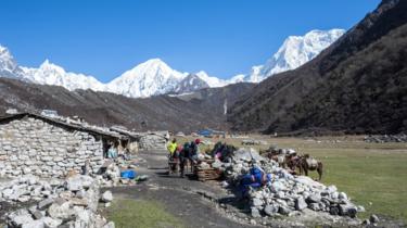 Trekkers in the village of Bimthang as part of the Great Himalaya Trail