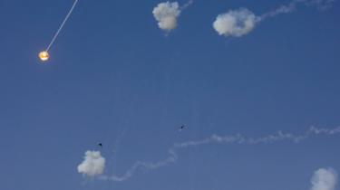 A rocket fired by Palestinian militants is intercepted by Israel's Iron Dome defence system above the Israeli city of Sderot on 13 November 2019