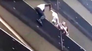 Mamoudou Gassama scales building to rescue child. 27 May 2018