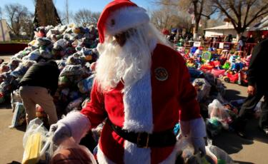 A firefighter dressed as Santa Claus