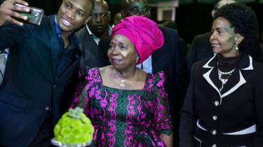A guest takes a selfie with Nkosazana Dlamini-Zuma during a presidential Gala dinner at the Nasrec Expo Centre in Johannesburg on December 15, 2017