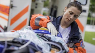 Female paramedic with patient