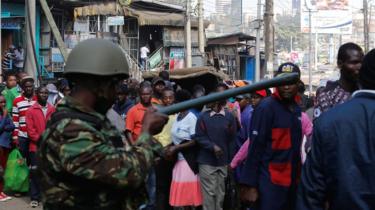 Riot police at the scene of the Gikomba market fire, Nairobi, Kenya - 28 June 2018