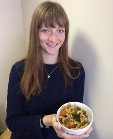 Rachel Tranter with a bowl of vegan pasta