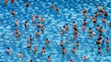 Swimming pool full of people